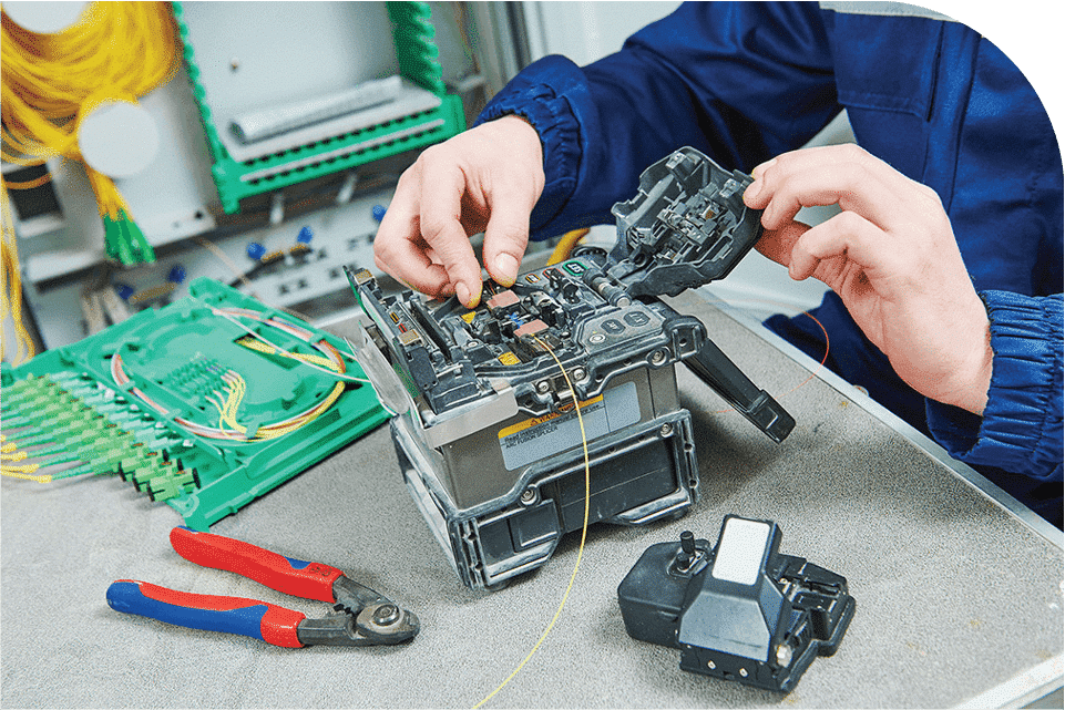 Technician completing a fibre installation and termination